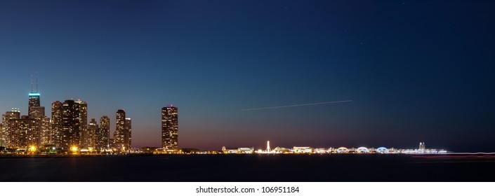 Chicago City Skyline And Lake Michigan Shore Navy Pier At Night