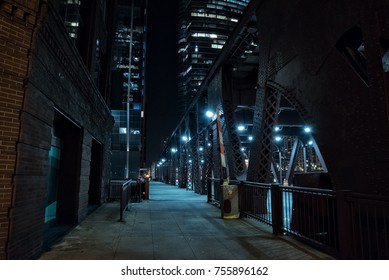 Chicago City Vintage River Drawbridge With Urban Downtown Buildings At Night.