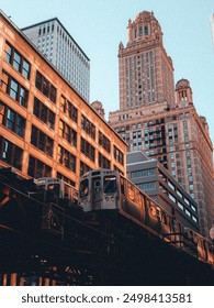 A Chicago cityscape featuring an elevated train passing through urban buildings. The scene captures the essence of city life with tall structures, bustling streets, and a dynamic urban atmosphere.

