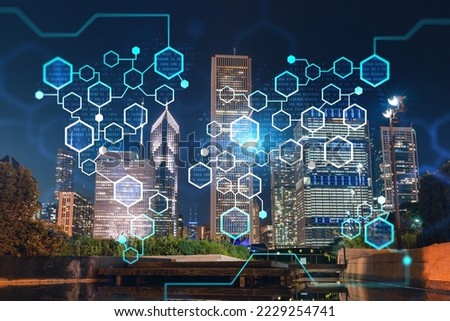 Chicago downtown area city view and Millennium Park, night time, Illinois, USA. Skyscrapers of financial district. Decentralized economy. Blockchain, cryptography and cryptocurrency concept, hologram