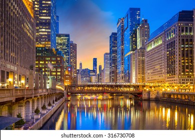 Chicago Downtown And Chicago River At Night In USA.