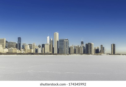 Chicago downtown view in winter scenery with snow and frozen lake