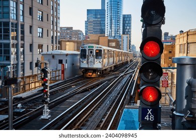 Chicago Elevated Train in Motion with Red Signal Light