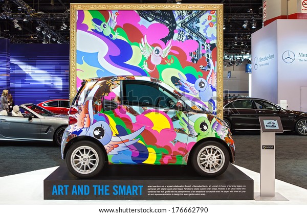 CHICAGO - FEBRUARY 6 : A\
Smart car wrapped in graffiti artwork by Miguel Paredes on display\
at the Chicago Auto Show media preview February 6, 2014 in Chicago,\
Illinois.
