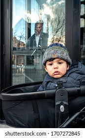 Chicago, IL - April 15th, 2020: A Boy In A Stroller Passes In Front Of A Cardboard Cutout Of Mayor Lori Lightfoot In The Corner Of Hutch American Kitchen + Bar During The COVID-19 Stay At Home Order.