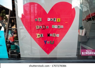 Chicago, IL - April 15th, 2020: A Heart Shaped Poster With Inspirational Messaging Sits In A Window Of A Small Business In Andersonville Neighborhood During The COVID19 Pandemic And Stay At Home Order