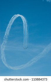 CHICAGO, IL - AUGUST 18: Aerobatic group formation over Lake Michigan at North Avenue Beach during airshow on Chicago Lakefront August 18, 2012 in Chicago, IL. - Shutterstock ID 110884373