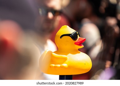 Chicago, IL - August 5th, 2021:  A Close Up Of A Plastic Rubber Ducky Staged Near The Finish Line As Crowds Gather Along The Shoreline Of The River For Special Olympics Illinois Annual Ducky Derby.