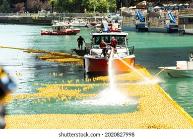 Chicago, IL - August 5th, 2021: The Chicago Fire Department Uses Two Hoses To Spray The 70,000 Rubber Ducks Down The Chicago River During The Special Olympics Illinois Annual Ducky Derby In Downtown.