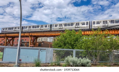 Chicago, IL August 7, 2016, Aerial Elevated CTA Chicago Transit Authority Blue Line Train Above The 606 Bloomingdale Pedestrian Trail