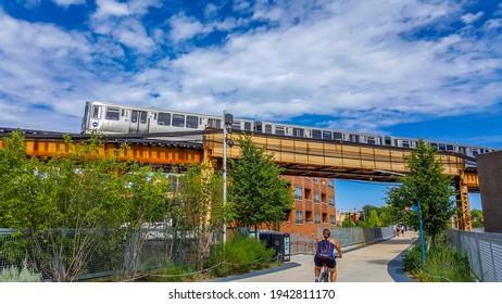 Chicago, IL August 7, 2016, Aerial Elevated CTA Chicago Transit Authority Blue Line Train Above The 606 Bloomingdale Pedestrian Trail