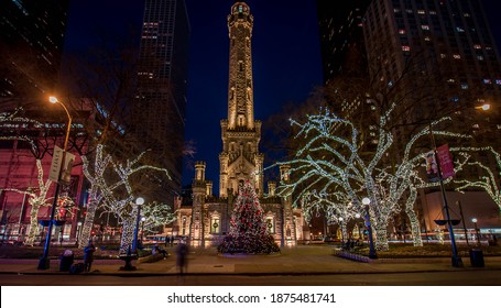 Chicago, IL December 10, 2020, Chicago Historic Water Tower Place At Night, With A Christmas Tree Decorated With Christmas Holiday Lights