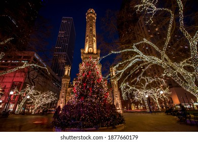 Chicago, IL December 10, 2020, Chicago Historic Water Tower Place At Night, With A Christmas Tree Decorated With Christmas Holiday Lights