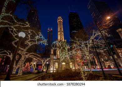 Chicago, IL December 10, 2020, Chicago Historic Water Tower Place At Night, With Trees Decorated With Christmas Holiday Lights