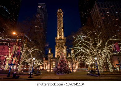 Chicago, IL December 10, 2020, Chicago Historic Water Tower Place At Night, With A Christmas Tree Decorated With Christmas Holiday Lights