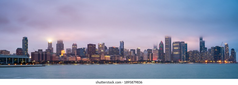 Chicago, IL - January 2 2021: Panoramic Chicago Skyline In The Fog At Night