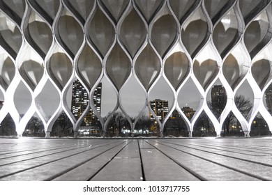 Chicago, IL - January 23, 2018: The Snow Sits On The Roof And Surrounding Landscape Of The People's Gas Pavilion Designed By Architect Jeanne Gang On A Still Winter Night In Chicago.