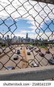 Chicago, IL - June 8th, 2022: Vehicular Traffic Moves Below The Overpass Bridges As People Commute Towards Downtown On The Kennedy Expressway On A Sunny Wednesday Morning.