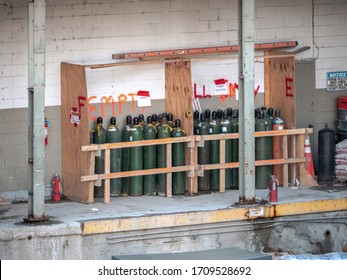 Chicago, IL - March 10th, 2020: Canisters Of Full And Empty Oxygen Tanks Sit Outside The Tribune Tower Construction Job Site During The Renovation And Conversion To Residential Condominiums.