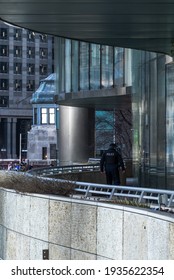 Chicago, IL - March 13th, 2021: A Member Of The Chicago Police Department Walks Along The Chicago River During The Surprise St. Patrick's Green Dye Event.