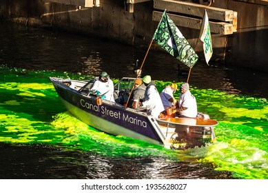 Chicago, IL - March 13th, 2021: Members Of The Chicago Local 130 Plumber's Union Make Their Initial Pass Dumping Dye Into The Chicago River Turning It Green In A Surprise St. Patrick's Day Event.