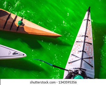 Chicago, IL - March 16th, 2019:  Kayak Boats Gather In The Freshly Dyed Chicago River On St. Patrick's Day As They Get An Up Close Look At The Bright Green Water.