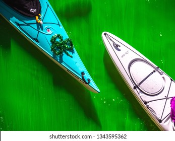 Chicago, IL - March 16th, 2019:  Kayak Boats Gather In The Freshly Dyed Chicago River On St. Patrick's Day As They Get An Up Close Look At The Bright Green Water.