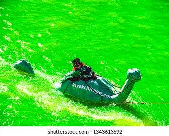 Chicago, IL - March 16th, 2019:  Kayak Chicago Makes Their Annual Appearance In The Dyeing Of The Chicago River On St. Patrick's Day With A Green Loch Ness Monster In Tow Ridden By A Leprechaun.