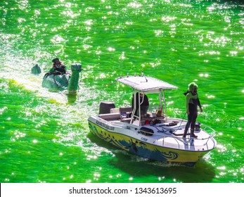 Chicago, IL - March 16th, 2019:  Kayak Chicago Makes Their Annual Appearance In The Dyeing Of The Chicago River On St. Patrick's Day With A Green Loch Ness Monster In Tow Ridden By A Leprechaun.