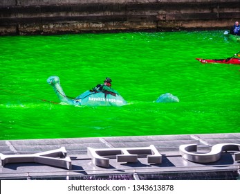 Chicago, IL - March 16th, 2019:  Kayak Chicago Makes Their Annual Appearance In The Dyeing Of The Chicago River On St. Patrick's Day With A Green Loch Ness Monster In Tow Ridden By A Leprechaun.