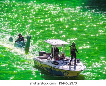 Chicago, IL - March 16th, 2019:  Kayak Chicago Makes Their Annual Appearance In The Dyeing Of The Chicago River On St. Patrick's Day With A Green Loch Ness Monster In Tow Ridden By A Leprechaun.