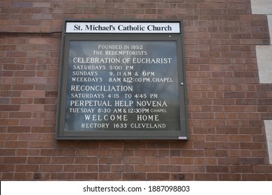 Chicago, IL May 17, 2020, Bulletin Board With Church Service Schedules Outside Of St Michael Catholic Church In Old Town Exterior Under A Blue Sky