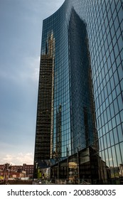 Chicago, IL - May 30, 2019: Reflection Of Several Skyscrapers In A Curved Glass Wall Of A Tall Building