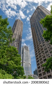 Chicago, IL - May 30, 2019: Several Skyscrapers Surrounded By Green Trees. View From The Ground