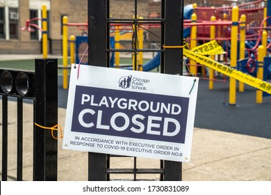 Chicago, IL - May 3rd, 2020: Yellow Restricted Area Caution Tape And Posted Sign Blocks Off A Playground At Swift School Part Of Chicago Public Schools In Response To Executive Order Number 8.