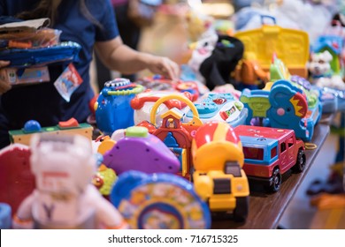 Chicago, IL, September 16, 2017: One Toy In Focus On A Table At A Community Yard Sale  For Families In A Church Gymnasium In The North Center Neighborhood, Known For Being Very Family Friendly.