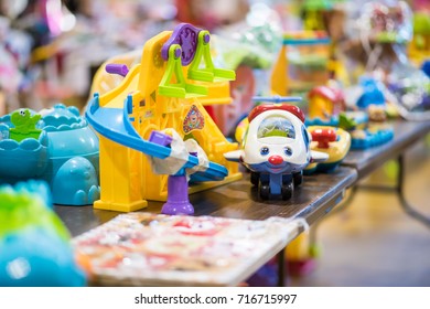 Chicago, IL, September 16, 2017: One Toy In Focus On A Table At A Community Yard Sale  For Families In A Church Gymnasium In The North Center Neighborhood, Known For Being Very Family Friendly.