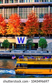 Chicago, IL / USA - 11/4/2016: Water Taxi Carrying Fans Across A Blue-dyed Chicago River During Cubs World Series Celebration 2016.