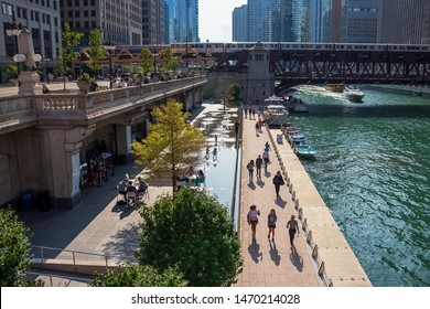 Chicago, IL / USA - 7/23/19:  People Enjoy Summer In Chicago On Riverwalk, Splash Pad, Boat, Wacker Dr., And El Trail Over Chicago River