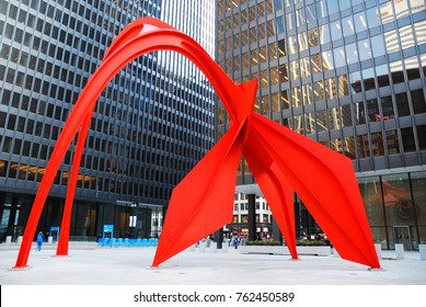 Chicago, IL, USA April 8 Alexander Calder's sculpture Flamingo dominates a public square in Chicago.  The city mandates all new construction dedicate a portion of their budget to public art