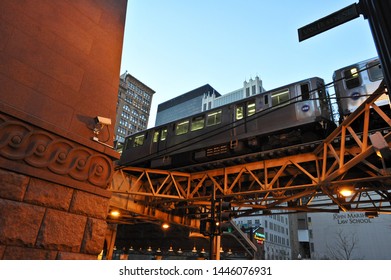 CHICAGO, IL / USA - DECEMBER 8 2010: A CTA Brown Line Train Rides On The Elevated Tracks Over E Van Buren At S State Street, Past John Marshall Law School.