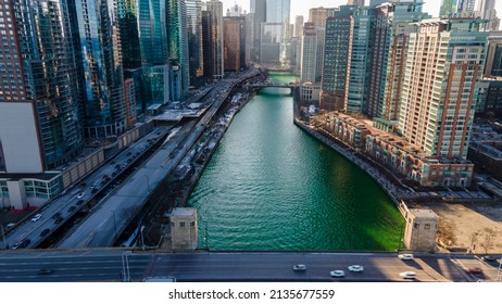 Chicago, IL USA- March 13th 2022: Aerial Drone Shot Of Downtown Chicago By The River During Early Spring Summer.  The Beautiful Skyscrapers Look Futuristic  Along The Green Lake Water