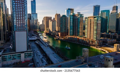 Chicago, IL USA- March 13th 2022: Aerial Drone Shot Of Downtown Chicago By The River During Early Spring Summer.  The Beautiful Skyscrapers Look Futuristic  Along The Green Lake Water