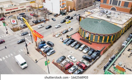 CHICAGO, IL, USA - MARCH 2, 2020: A drone / aerial view of the Hard Rock Cafe in downtown Chicago with cars driving by and a Walgreens store in the background. 