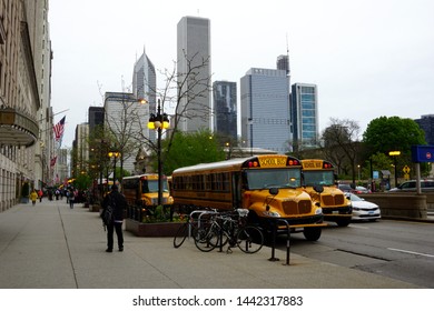 Chicago, IL, USA - May 17, 2019: School Bus Excursion On Michigan Ave With City Skyline In The Background.