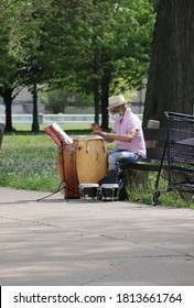 Chicago, IL / USA - May 25, 2020: An Old Man Playing His Wooden Conga ( Tumbadora) Drums In The Park