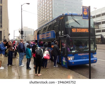 CHICAGO, IL, USA - MAY 27 2013: 2013: Passengers, On S Canal Street Across From Union Station Self Park, Wait To Board A Blue Megabus Bound For Indianapolis.