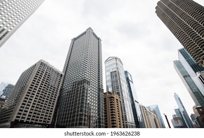 CHICAGO, ILLINOIS - APRIL 18, 2021: Looking up to tall buildings, new real estate developments, and offices in downtown Chicago. - Shutterstock ID 1963626238