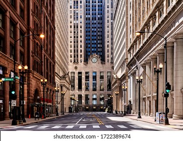 Chicago Illinois, – April 2nd 2020: Corner Of LaSalle & W. Adams St.: Chicago Loop Ghost-town Appearance; No Cars, & Only A Couple Of People On The Street – Prompted By Covid-19 Restrictions.     