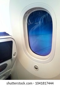 Chicago, Illinois - February 18, 2018 - Automatic Airplane Window With Dimming Effect On All Nippon Airways Flight 